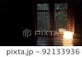 Mountain hut in the forest It rains outside the window The focus is indoors 92133936
