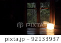 Mountain hut in the forest It rains outside the window The focus is outside 92133937