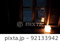 Mountain hut in the forest It rains outside the window The focus is indoors 92133942