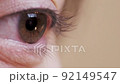 Close-up of a female eye, blinking, long eyelashes. Healthy look, excellent vision. Macro, 4k 92149547
