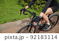 Beautiful summertime mood shot of young woman or girl riding bicycle 92183114