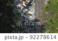 Video of quadrocopter flying above garbage dump in forest 92278614
