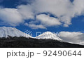 A spectacular view of winter in Hokkaido: Clouds flowing over Mt. Akan Fuji and Mt. Meakan 92490644