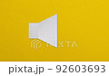 white paper speaker set on a yellow background. 92603693