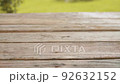 Old wooden table outdoors 92632152