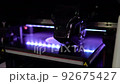 3d printer prints object close-up. Automatic three dimensional 3D printer. 92675427