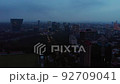 Drone moving above the skyscrapers of Mexico city at sunset with cloudy sky 92709041