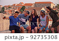 Diverse Young Friends Talking And Taking Selfies On Vacation In Europe Travel Lifestyle Happiness And Destination Exploration Tourism As A Family Together Love Summer Concept 92735308