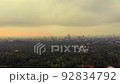 Aerial view of the cityscape of Mexico City full of green trees at sunshine 92834792