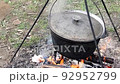 black cauldron on campfire 92952799