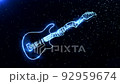 Electric guitar in a frosty glow in a dark space with particles 92959674