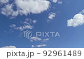 Clouds appear in the blue sky and disappear during the day. Timelapse. Accelerated video of a natural phenomenon 92961489