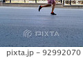runner legs running marathon race slow motion 92992070