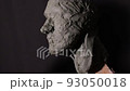 Man sculptor creates sculpt bust clay human woman sculpture. Statue craft creation workshop. 93050018
