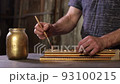 Framing Workshop. Painting baguette handmade picture frame at studio. 93100215