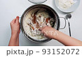 Housewife cooks in a saucepan 93152072