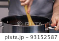 Unrecognizable woman cooking on kitchen 93152587