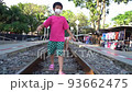 Asian kids in walking on a Train tack in Kanchanaburi, Thailand. 93662475