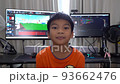 Kid with computer programming and game developing in background, for technology coding concept. 93662476
