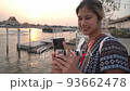 Asian Female Tourist is taking selfie in Chaopraya river in Bangkok, Thailand. 93662478