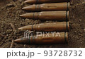 Pile of old cartridges for automatic weapons, close-up 93728732