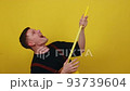 Happy janitor in uniform is happy to take on the job of cleaning the house 93739604