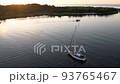 Aerial drone top view with copy space of luxury speed boat cruising in high speed in blue sea. Reflection of the sailing yatch and golden sunset in water. Leisure time at nautical vessel in the ocean 93765467