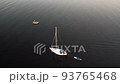 Aerial drone top view with copy space of luxury speed boat cruising in high speed in blue sea. Reflection of the sailing yatch and golden sunset in water. Leisure time at nautical vessel in the ocean 93765468