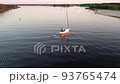 Aerial drone top view with copy space of luxury speed boat cruising in high speed in blue sea. Reflection of the sailing yatch and golden sunset in water. Leisure time at nautical vessel in the ocean 93765474