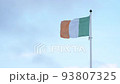 National flag of the republic of Ireland waving in wind on blue sky background, Irish flag 93807325