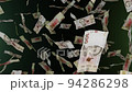 Many wads of money falling down. 100 Ukrainian hryvnia banknotes. Money rain. 94286298