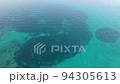 Drone view of beautiful footage coastline. Aerial shot of beach with deep blue sea water and beach. 94305613