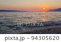 View of beautiful footage while big sea waves breaking on the coastline. Beautiful red sunset over the Adriatic sea. Makarska Riviera-Biokovo, Dalmatia, Croatia, Europe 94305620