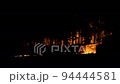 Long shot of Jungle fire at night in Netarhat, Jharkhand India. 94444581
