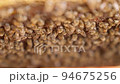 Bees fly and collect honey. The bees are getting ready for winter. Many bees that climb one on one in the evidence. Honey comb. 94675256