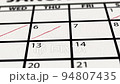 Crossing off days on calendar until the end of month 94807435