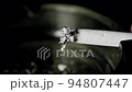 Lit cigarette burning in ashtray macro shot 94807447