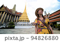 Asian woman in the dress traveling at Wat Phra Kaew or Emerald buddha temple in Bangkok Thailand 94826880