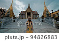 Asian woman in the dress traveling at Wat Phra Kaew or Emerald buddha temple in Bangkok Thailand 94826883