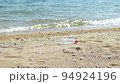 PET bottles washed up on the sandy beach 5 94924196
