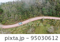 Traveling by van through the foggy jungle in Puebla state in Mexico 95030612