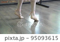 The ballerina feet closeup unrecognizable woman dancing with ribbon slow motion handheld shot 95093615