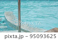Water spa pool surface jacuzzi bubbles resort hotel blue water slow motion pan shot 95093625