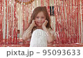 Little girl with toy dog robot walks 95093633