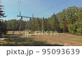 High voltage line aerial drone in forest push in forward camera movement 95093639