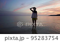A woman relaxing on a beautiful beach in Okinawa 95283754