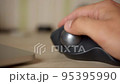 Designer works with trackball 95395990