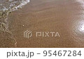 Slow motion of small sea waves on the sandy beach Slow motion of small sea waves on the sandy beach 95467284