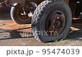 Old cracked and flat tire on a truck close-up. 95474039