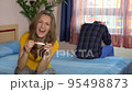 woman enjoys positive pregnancy test in bedroom. man unhappy with his wife joy takes his head. 4K 95498873